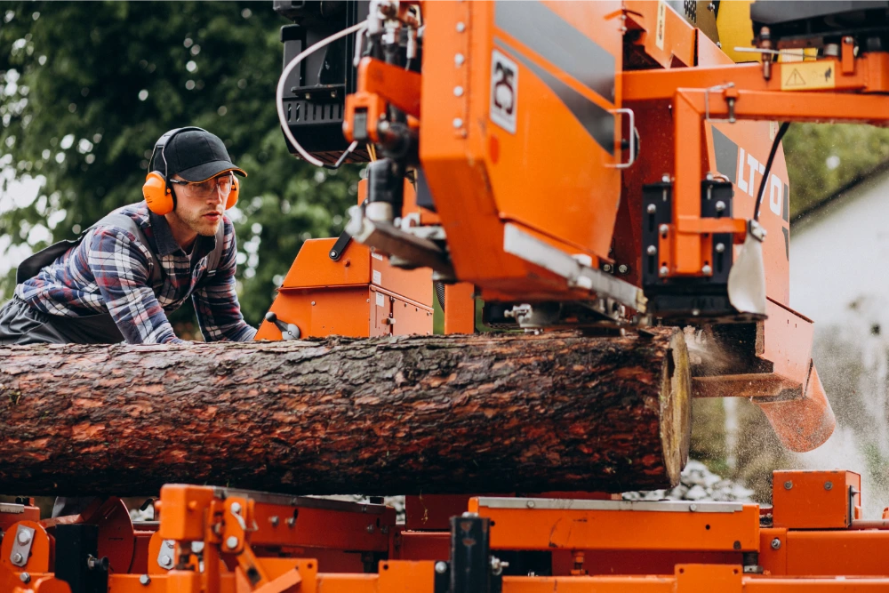 Tree service crew member with company truck